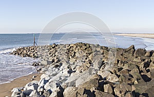 Sea coast with rock breakwater at Dinas Dinlle photo