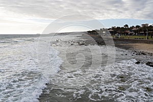 Sea coast waves on cloudy day in Meloneras, Gran Canaria photo