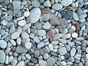 Sea colorful and gray small stones pebbles on a beach