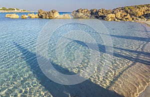 Sea colors of Italy:shadows on the shore. Summer seascape,Apulia coast: Marina di Pulsano beach & x28;Taranto& x29;, Canne bay.