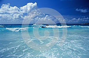 The sea crashes on the deserted beaches of Bird Island in the Seychelles