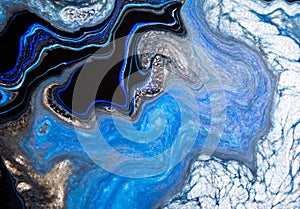Sea deep inspired abstract marble liquid texture in silver white glitter, indigo, ultramarine and black colors.