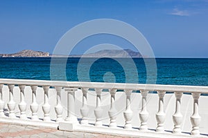 Sea and fence with white balusters