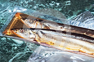Sea fish saury in vacuum packaging