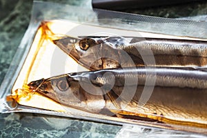 Sea fish saury in vacuum packaging