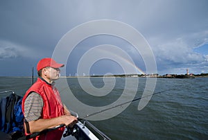 Sea fishing and lucky rainbow