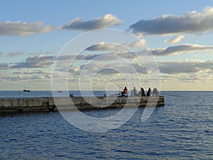 Sea fishing from the pier, Sochi resort, Russia