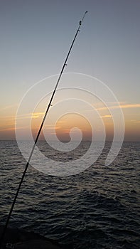 Sea fishing at sunset