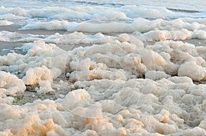 Sea foam on a beach