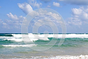 Sea foam on the sandy beach at Bat Yam, Israel