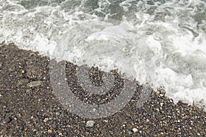 Sea foam on the shore of Black Sea. Sochi.