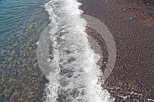 Sea foam on the shore of Black Sea. Sochi.