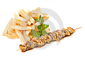 Sea food skewers with french fries