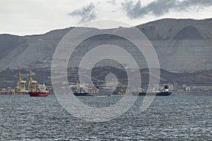 Sea freighter sailing in the middle of the ocean with big waves