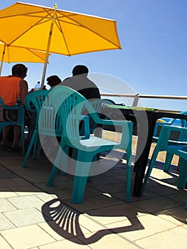 Sea front cafe beach table chair umbrella