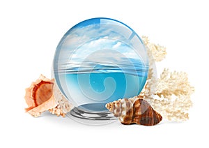 Sea in the glass ball with shell and coral on white background,