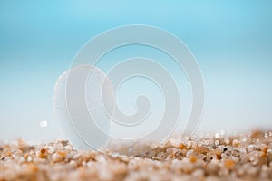 Sea glass on beach sand