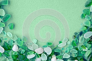 sea glass pieces on mint background