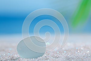 Sea glass seaglass on glitter sand with ocean , beach and seasca