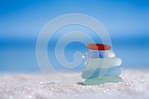 Sea glass seaglass on glitter sand with ocean , beach and seasca