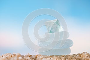 Sea glass tower on beach sand