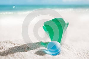 Sea glass on white sand beach