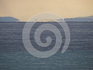 Sea in Greece. Fata morgana mirage on the horizon. photo