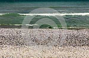 Sea green aquamarine waves line sunny seashell beach. wave ocean foam.