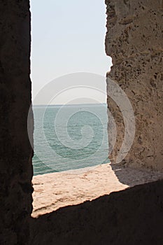 Sea and horizon line view from ancient medieval window