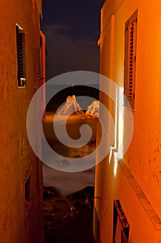 The sea between the houses.