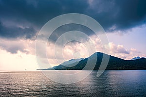 Sea and island with the rain cloud background