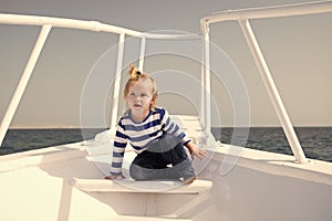 Sea journey. Baby boy enjoy vacation on cruise ship. Child cute sailor yacht sunny day. Boy adorable sailor striped