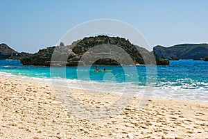 Sea kayaking in blue waters