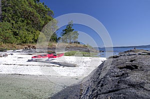 Sea kayaks on an west coast beach