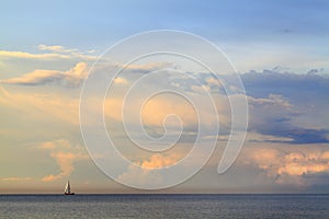 Sea landscape with aa lonely sailboat - Orlowo beach in Gdynia, Tricity, Poland