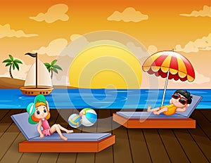 Sea landscape with boy and girl relax on sun lounger