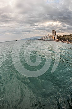 Sea landscape with building and mountains