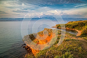 Sea landscape with mountains on background at sunset, Vir island