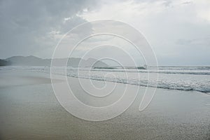 Sea landscape with rainy nimbostratus clouds. Rainy weather with heavy clouds.