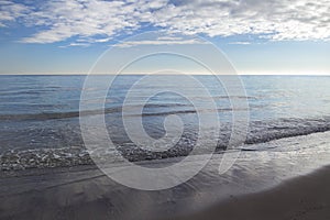 Sea landscape with stratocumulus clouds on sunset heaven