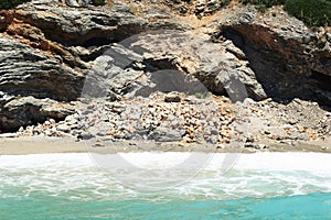 Sea landscape with unapproachable rock