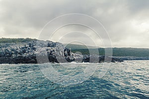 Sea Landscape Waves Crashing against the Rocky Shoreline, Cloudy Sky