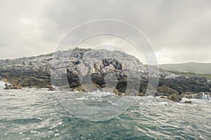 Sea Landscape Waves Crashing against the Rocky Shoreline, Cloudy Sky