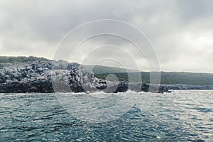 Sea Landscape Waves Crashing against the Rocky Shoreline, Cloudy Sky