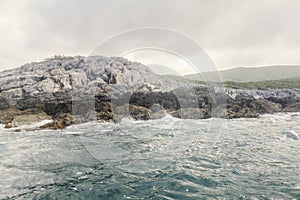 Sea Landscape Waves Crashing against the Rocky Shoreline, Cloudy Sky