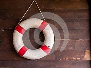 Sea lifebuoy on wooden background . Copy space for individual text