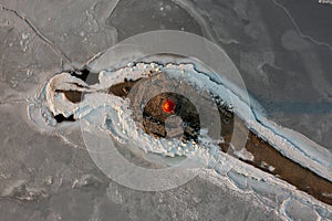 Sea Lighthouse on the Tokarevskaya Koshka rock spit, in winter.