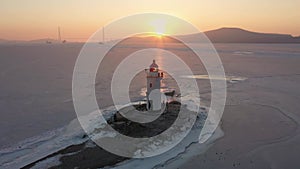 Sea Lighthouse on the Tokarevskaya Koshka rock spit, in winter.