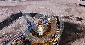 Sea Lighthouse on the Tokarevskaya Koshka rock spit, in winter