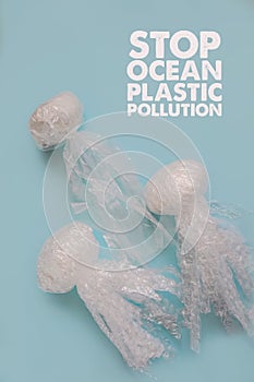 Sea and ocean life from waste. Jellyfishes out of plastic waste on blue background. Pollution of the planet